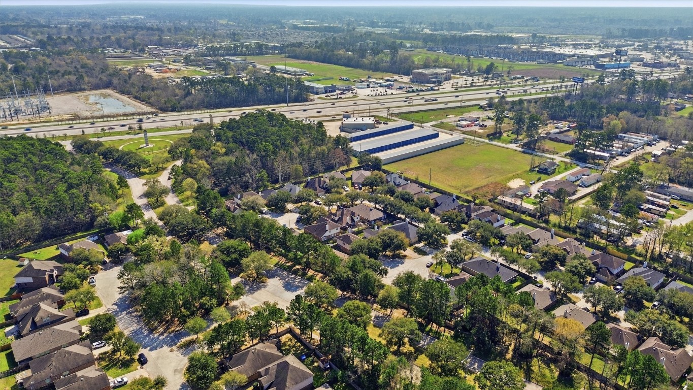 23301 Tuttle Court Porter, TX 77365 - Photo 46 of 50 an aerial view of residential houses with outdoor space and trees