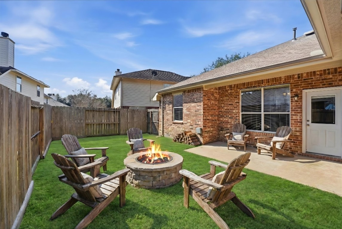 23301 Tuttle Court Porter, TX 77365 - Photo 8 of 50 a view of a backyard with table and chairs and a barbeque