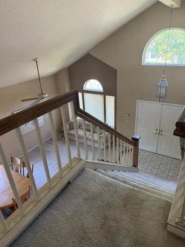 a view of staircase with a large window