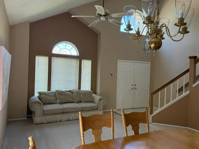 a room with a chair and a window