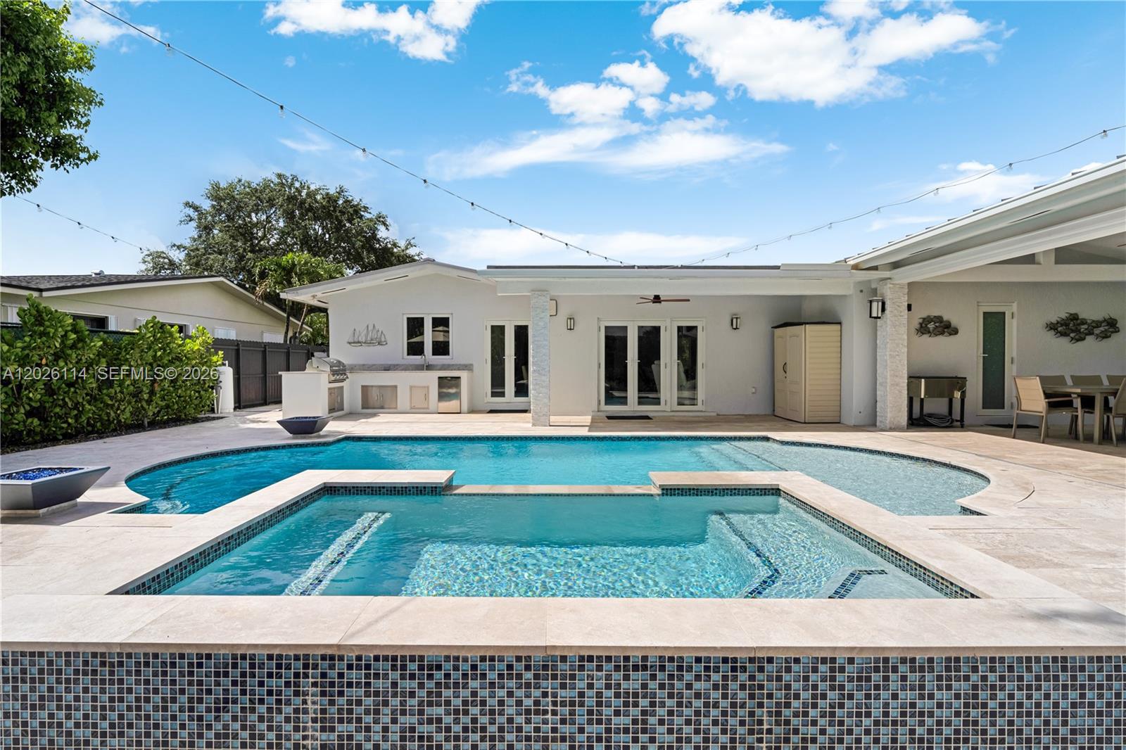 9641 Southwest 66th Street Miami, FL 33173 - Photo 44 of 57 a view of a house with swimming pool