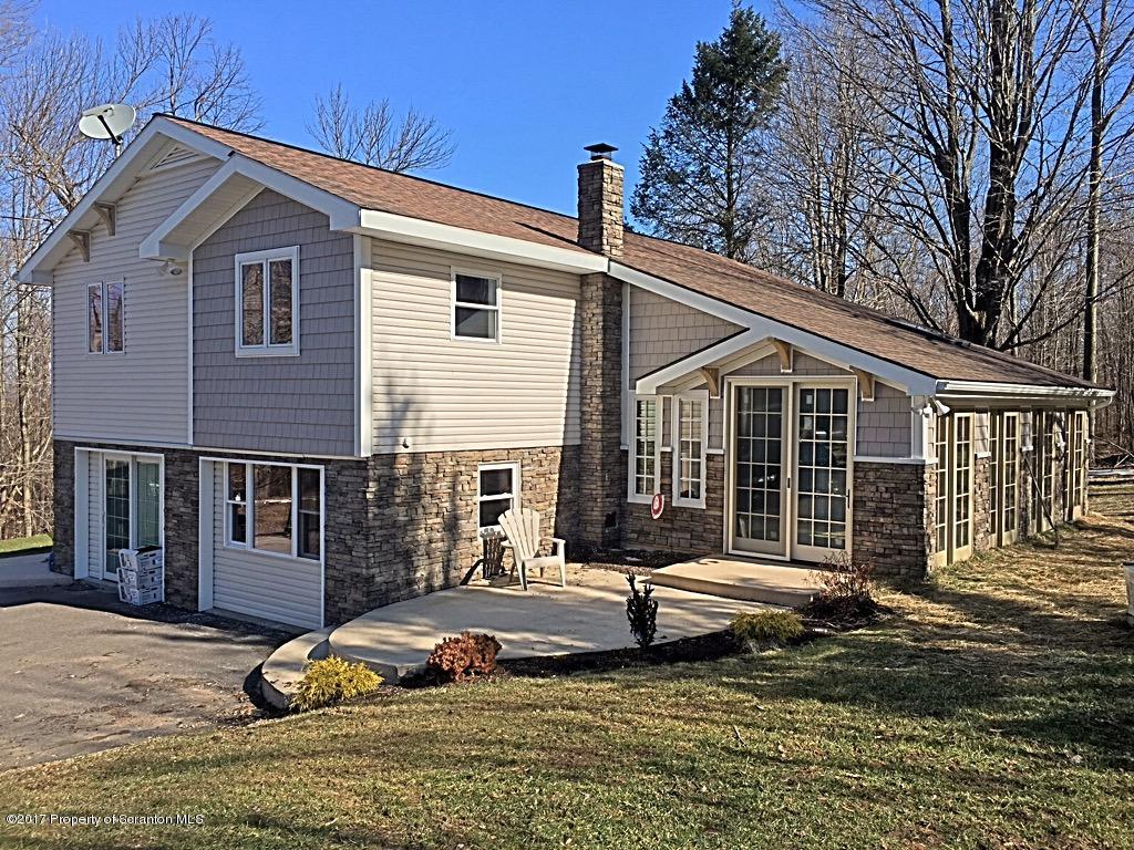 5275 Bloomington Road Moscow, PA 18444 - Photo 1 of 48 a front view of a house with a yard