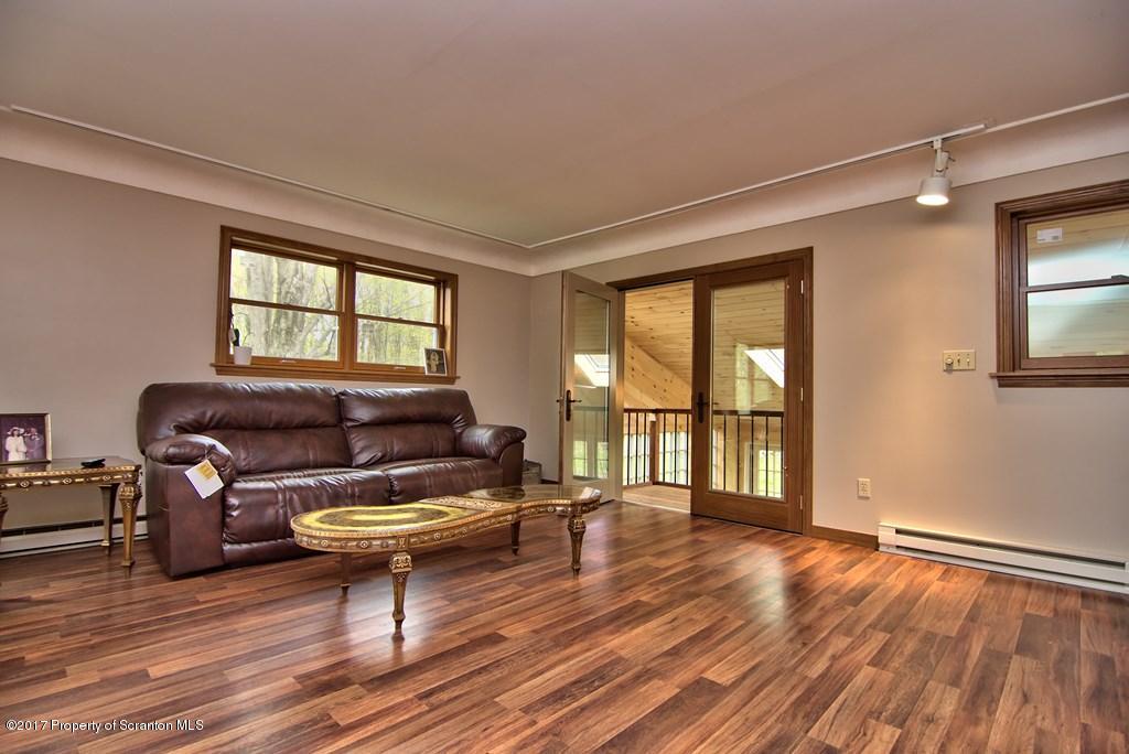 5275 Bloomington Road Moscow, PA 18444 - Photo 15 of 48 a living room with furniture and a window