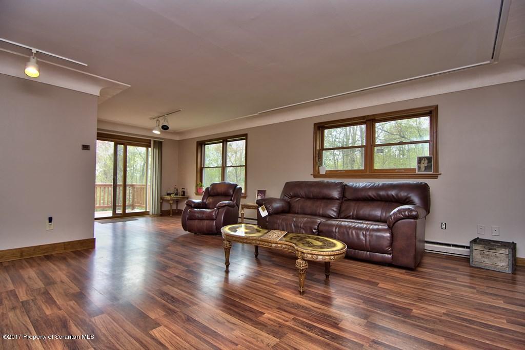 5275 Bloomington Road Moscow, PA 18444 - Photo 16 of 48 a living room with furniture and wooden floor