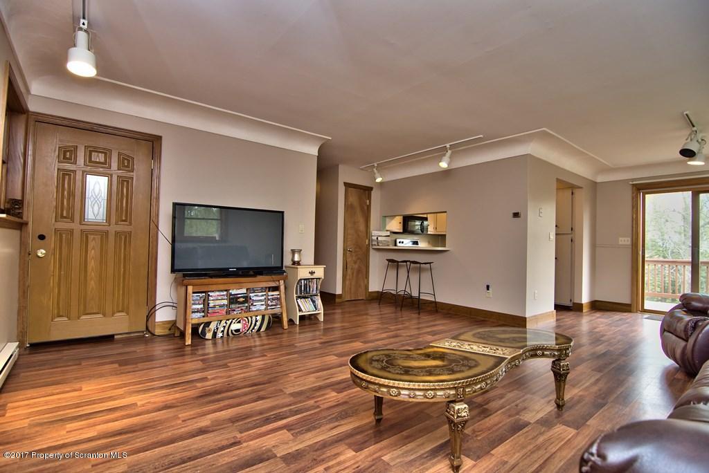 5275 Bloomington Road Moscow, PA 18444 - Photo 19 of 48 a living room with furniture and a flat screen tv