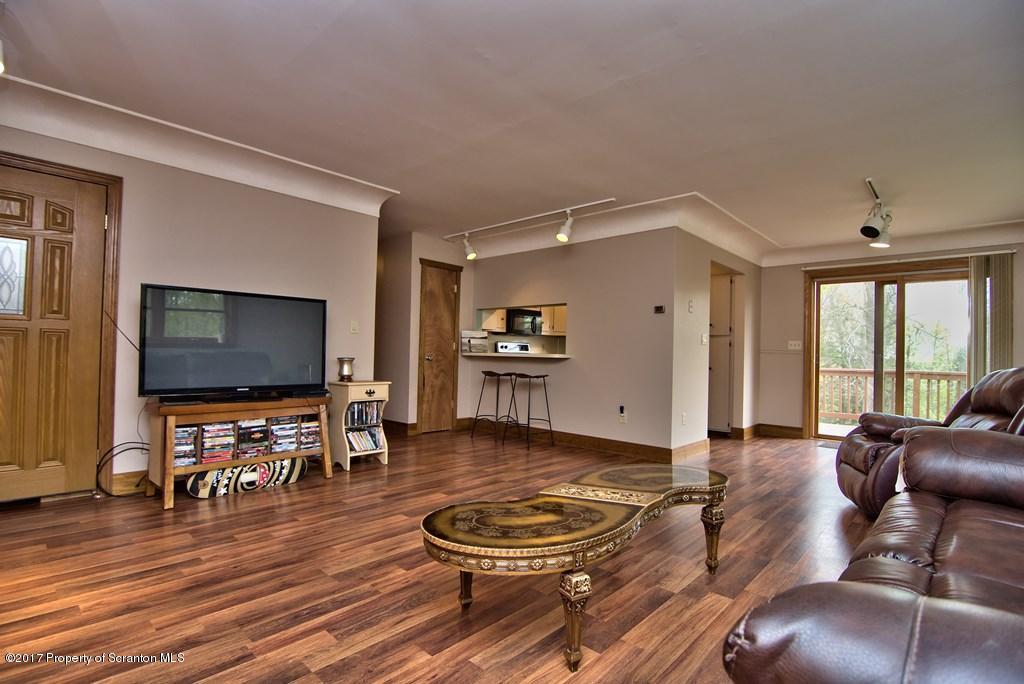 5275 Bloomington Road Moscow, PA 18444 - Photo 20 of 48 a living room with furniture and a flat screen tv