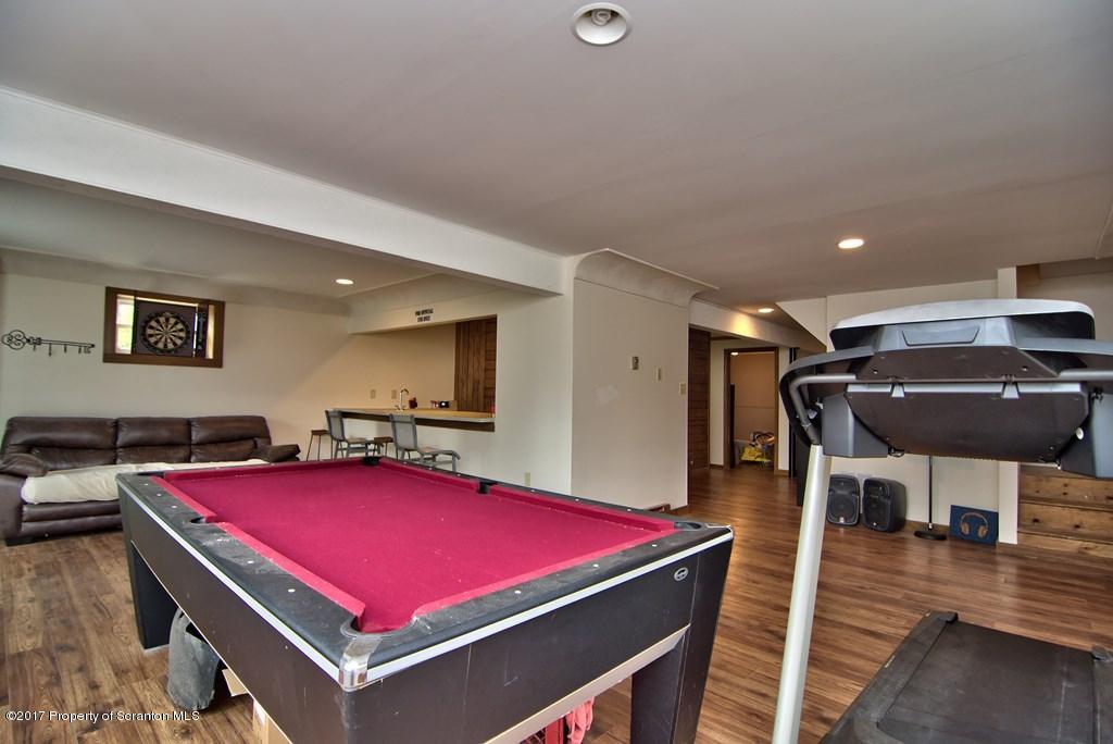 5275 Bloomington Road Moscow, PA 18444 - Photo 24 of 48 a room with furniture pool table table and wooden floor
