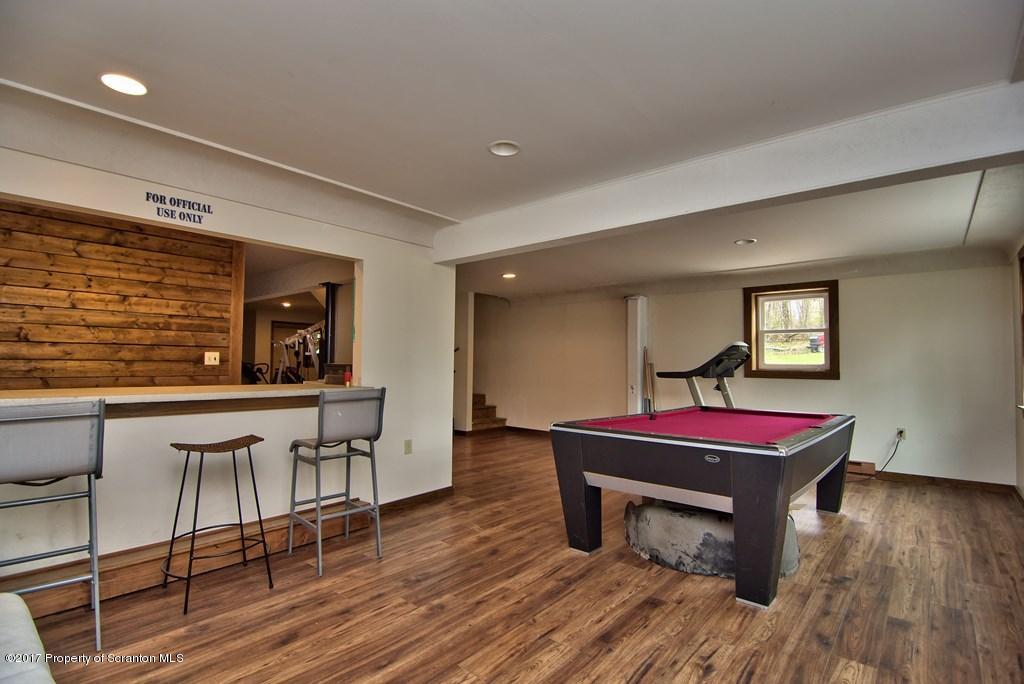 5275 Bloomington Road Moscow, PA 18444 - Photo 28 of 48 a room with furniture pool table table and wooden floor