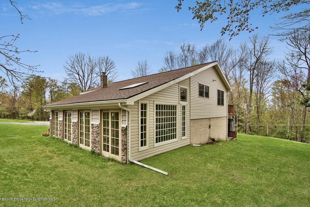 5275 Bloomington Road Moscow, PA 18444 - Photo 3 of 48 a view of a house with a yard