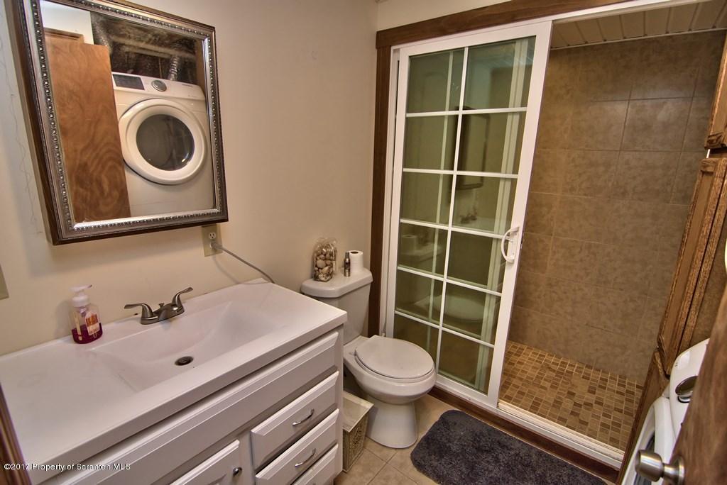 5275 Bloomington Road Moscow, PA 18444 - Photo 31 of 48 a bathroom with a sink and a toilet