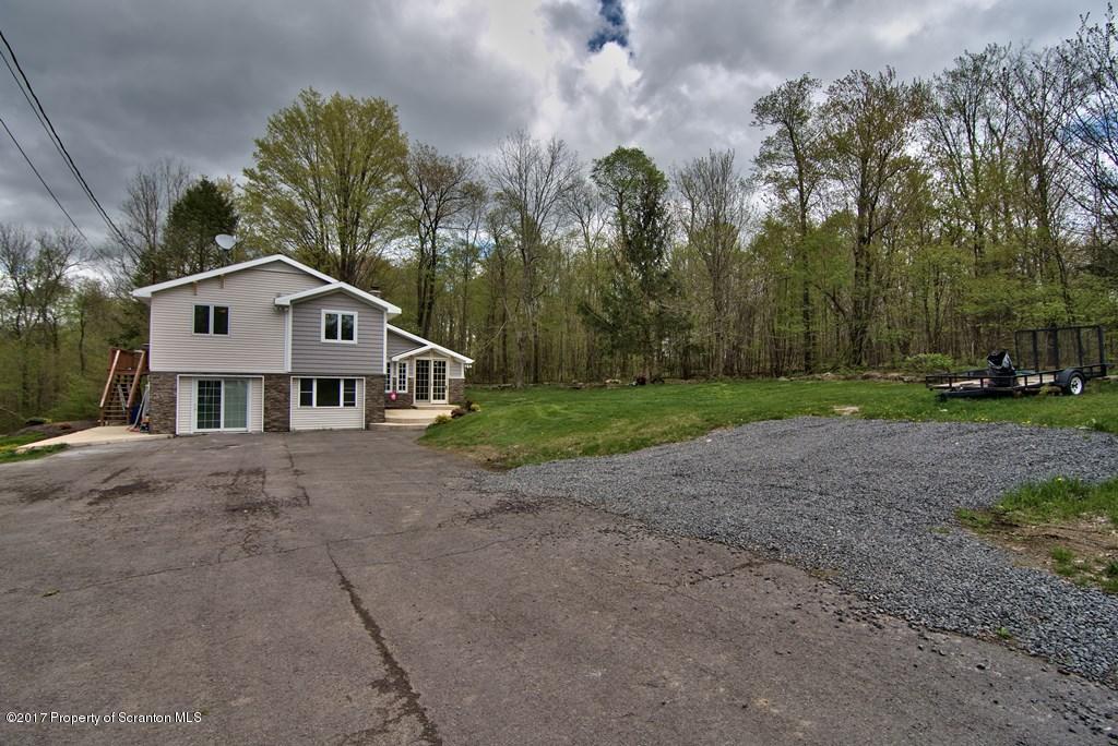 5275 Bloomington Road Moscow, PA 18444 - Photo 41 of 48 a house with trees in the background