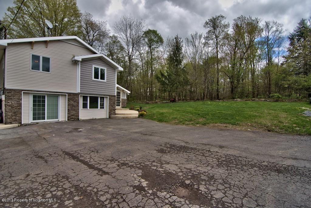 5275 Bloomington Road Moscow, PA 18444 - Photo 42 of 48 a view of a house with backyard and trees