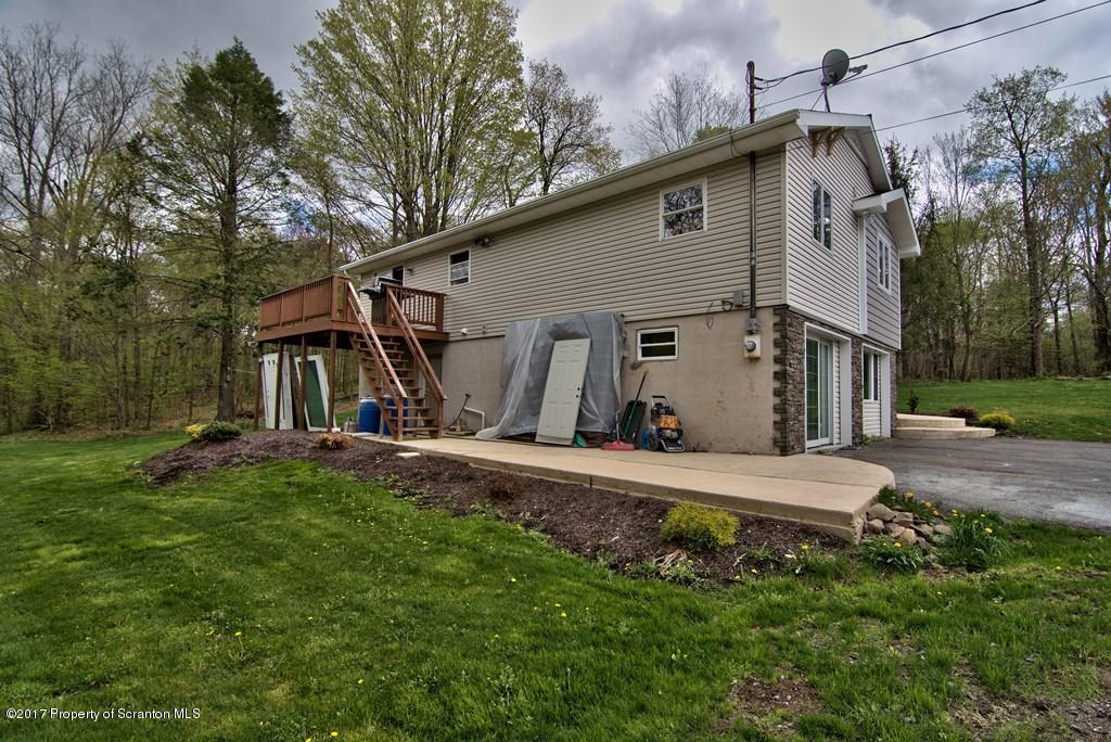 5275 Bloomington Road Moscow, PA 18444 - Photo 43 of 48 a view of a house with backyard and trees