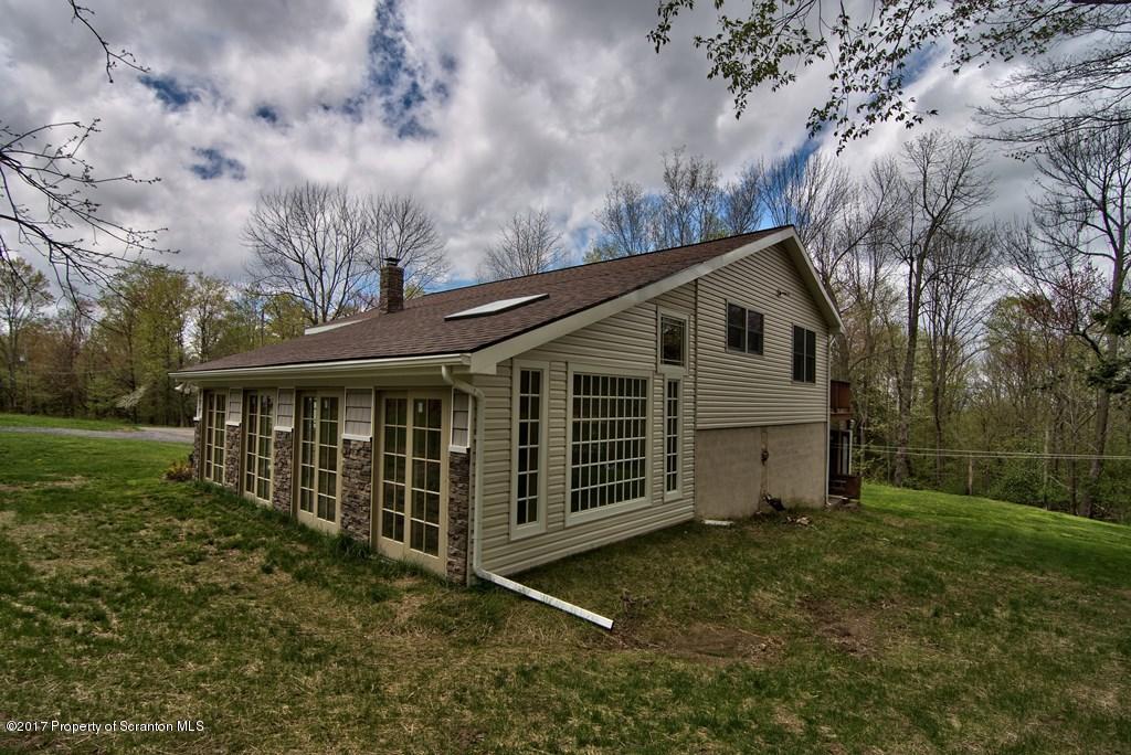 5275 Bloomington Road Moscow, PA 18444 - Photo 45 of 48 a view of a house with a yard
