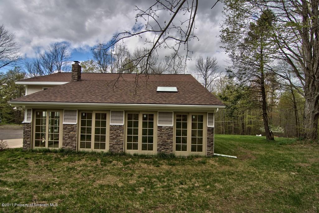 5275 Bloomington Road Moscow, PA 18444 - Photo 46 of 48 front view of a house with a yard