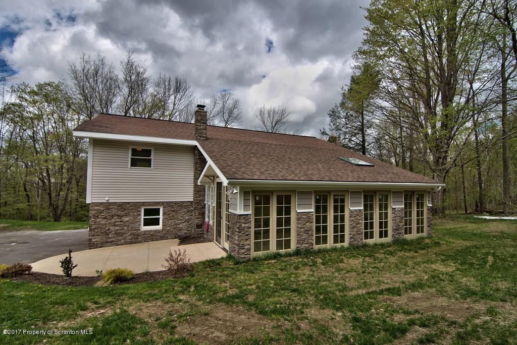 5275 Bloomington Road Moscow, PA 18444 - Photo 47 of 48 a view of a house with a yard and sitting area