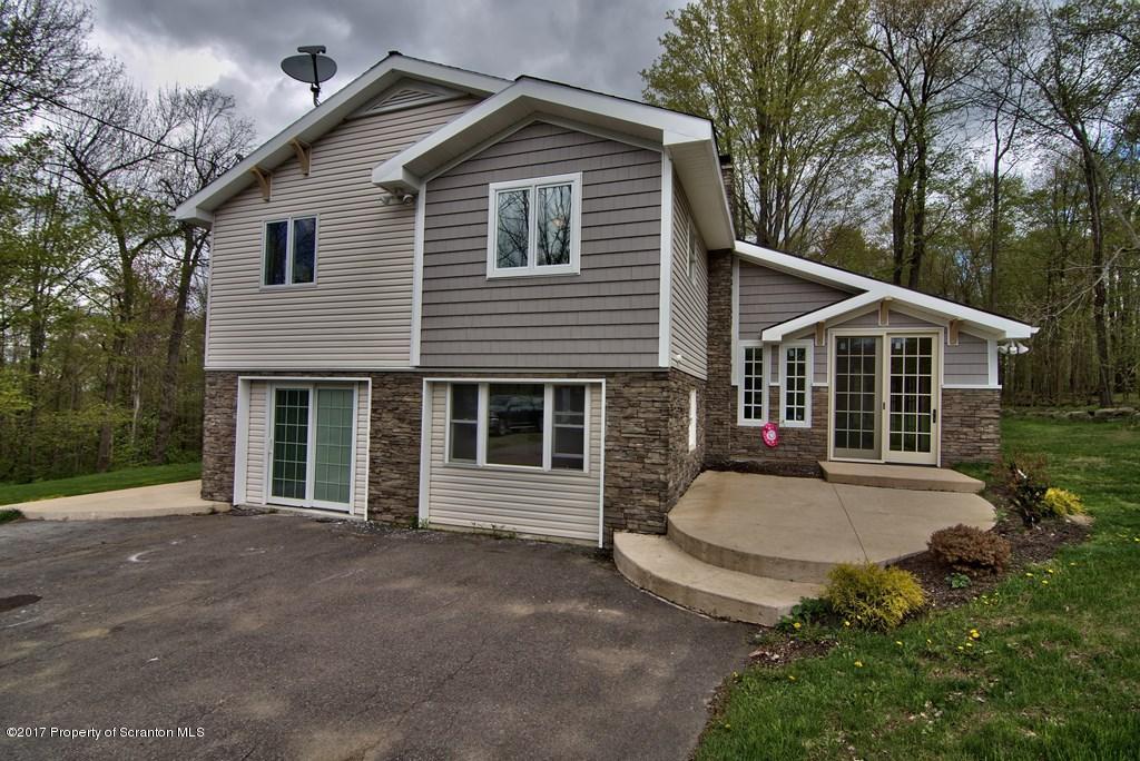 5275 Bloomington Road Moscow, PA 18444 - Photo 48 of 48 a front view of a house with a garden