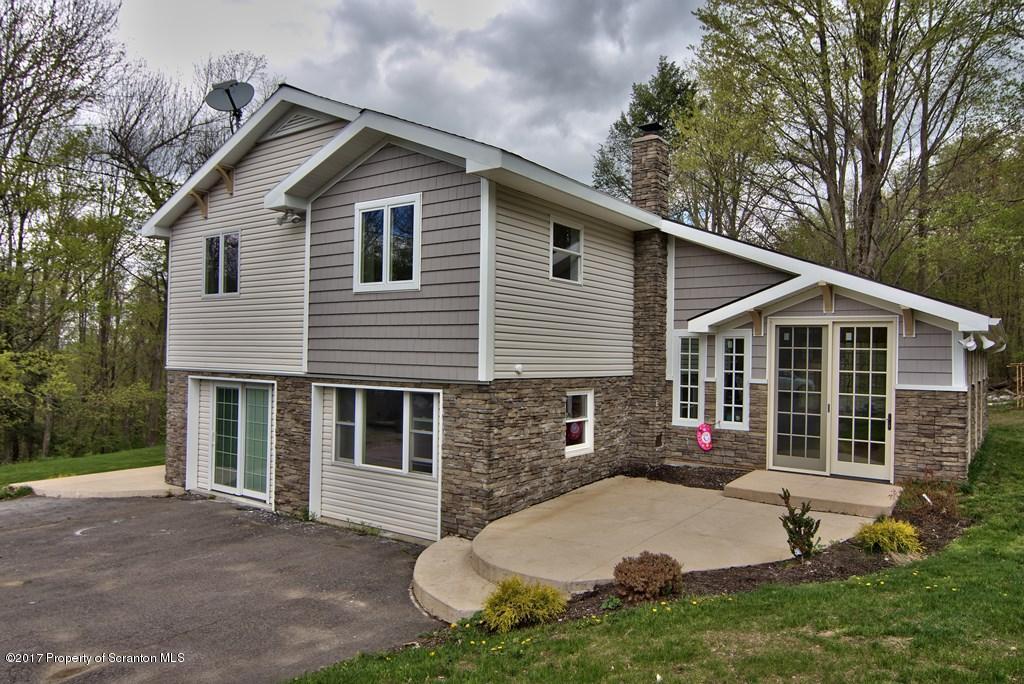 5275 Bloomington Road Moscow, PA 18444 - Photo 6 of 48 a view of a house with a yard and large tree