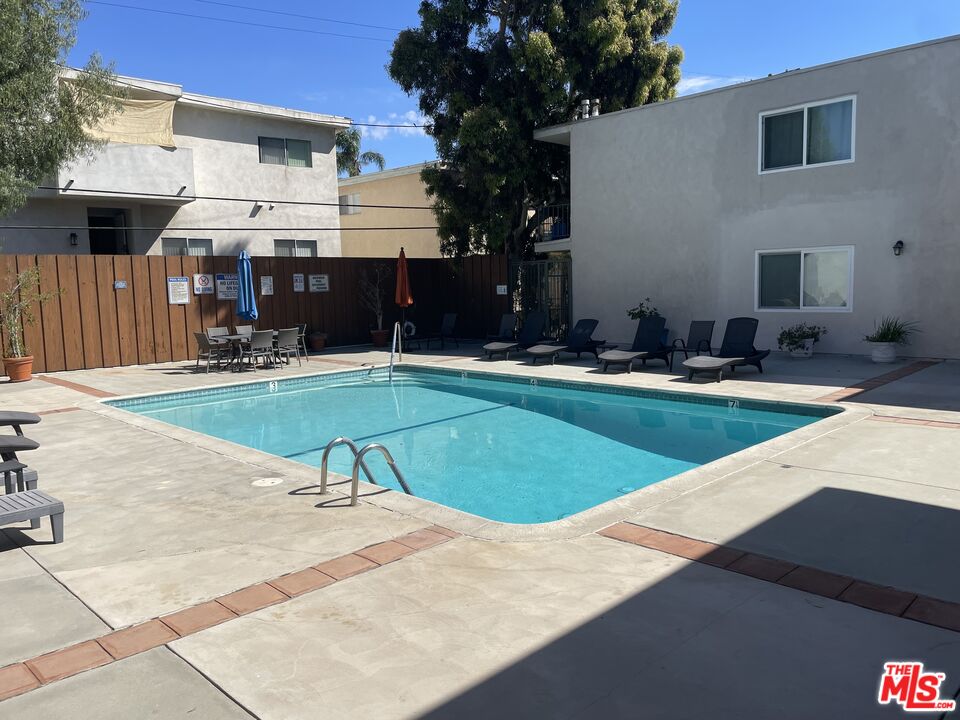 3640 Cardiff Avenue, Unit 108 Los Angeles, CA 90034 - Photo 11 of 14 a swimming pool with outdoor seating and yard