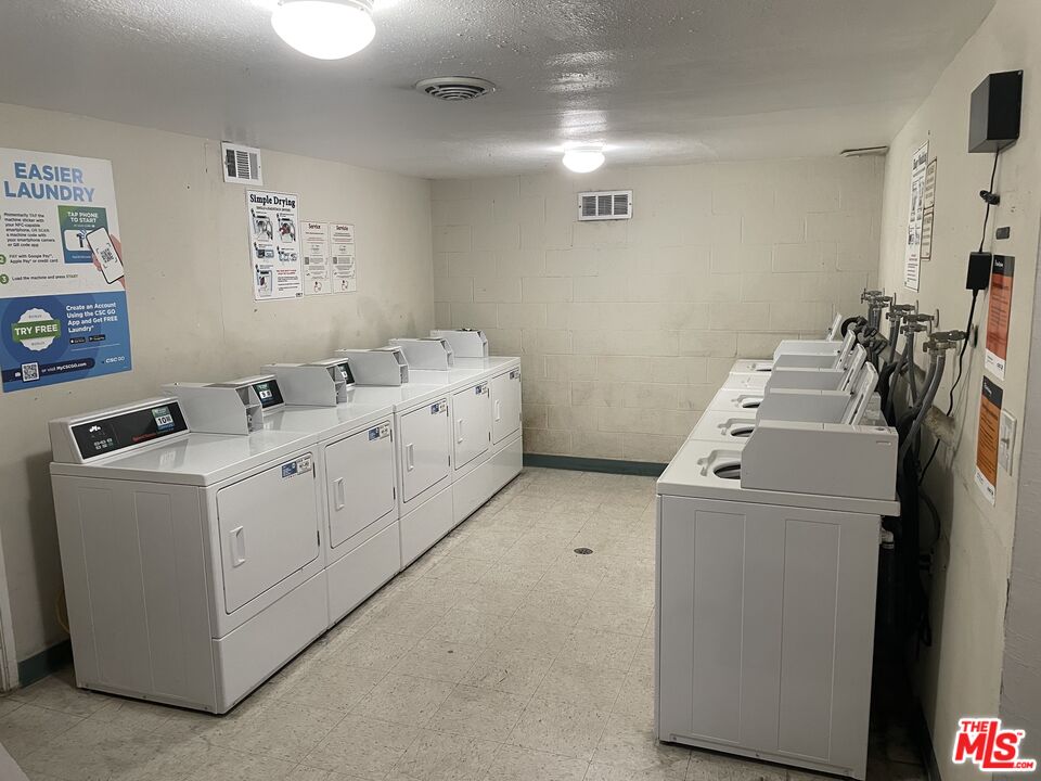 3640 Cardiff Avenue, Unit 108 Los Angeles, CA 90034 - Photo 12 of 14 a utility room with dryer and washer
