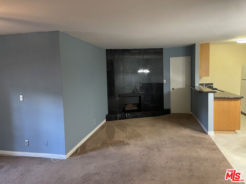 3640 Cardiff Avenue, Unit 108 Los Angeles, CA 90034 - Photo 5 of 14 a view of an empty room with a kitchen