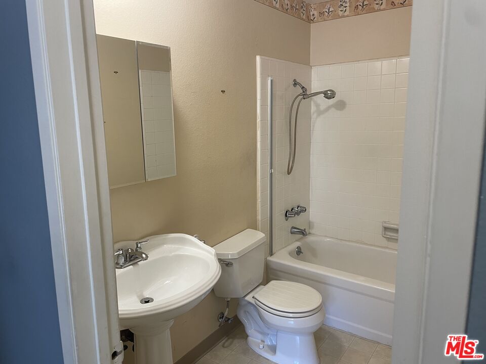 3640 Cardiff Avenue, Unit 108 Los Angeles, CA 90034 - Photo 7 of 14 a bathroom with a sink toilet and shower