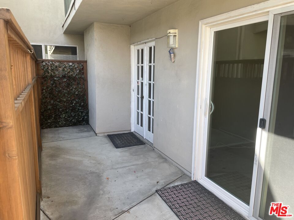 3640 Cardiff Avenue, Unit 108 Los Angeles, CA 90034 - Photo 10 of 14 a view of entryway with window and stairs