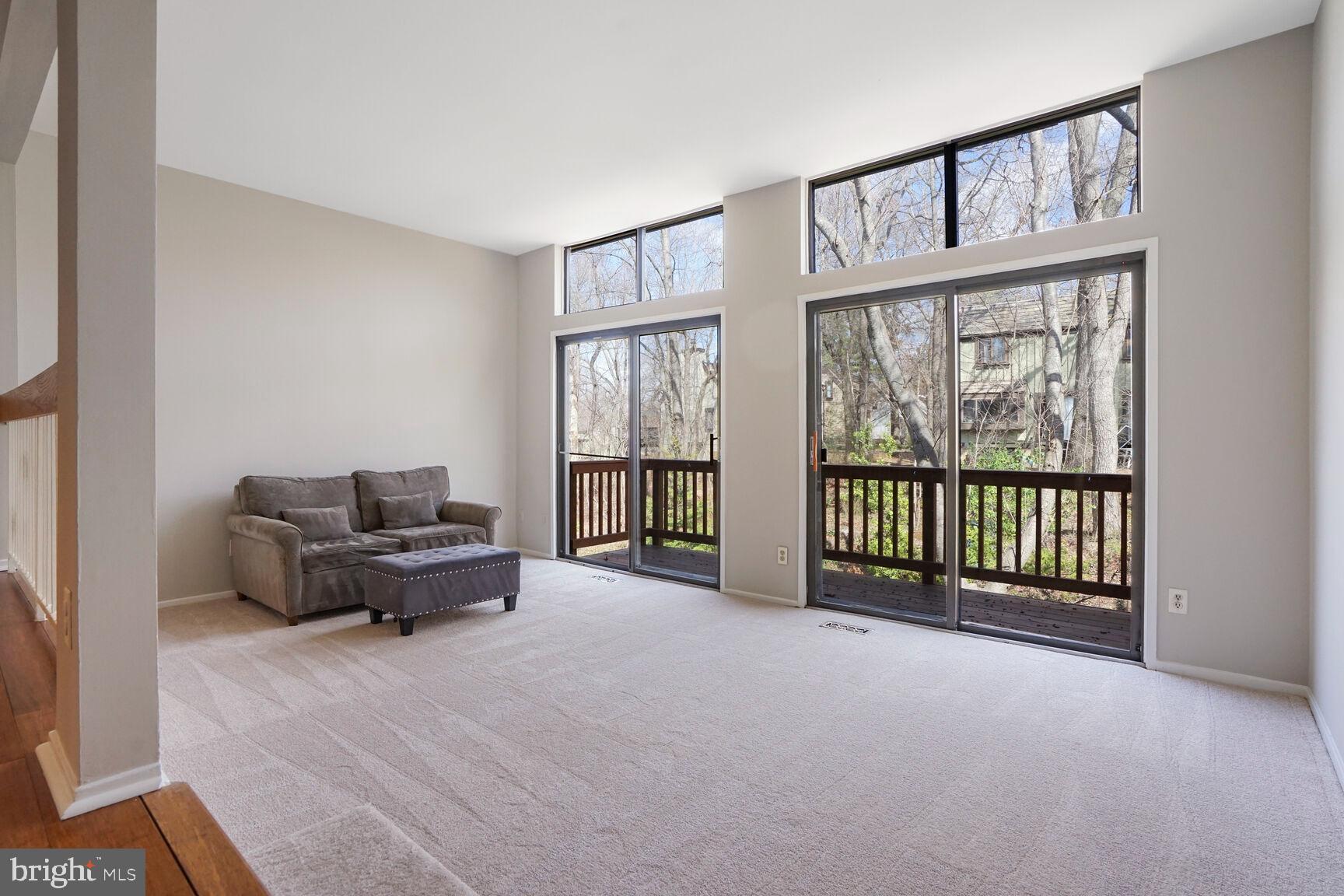 1526 Scandia Circle Reston, VA 20190 - Photo 2 of 22 a living room with furniture and large windows