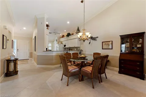 a view of a dining room and livingroom with furniture