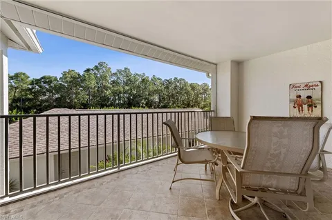 a view of a balcony with furniture