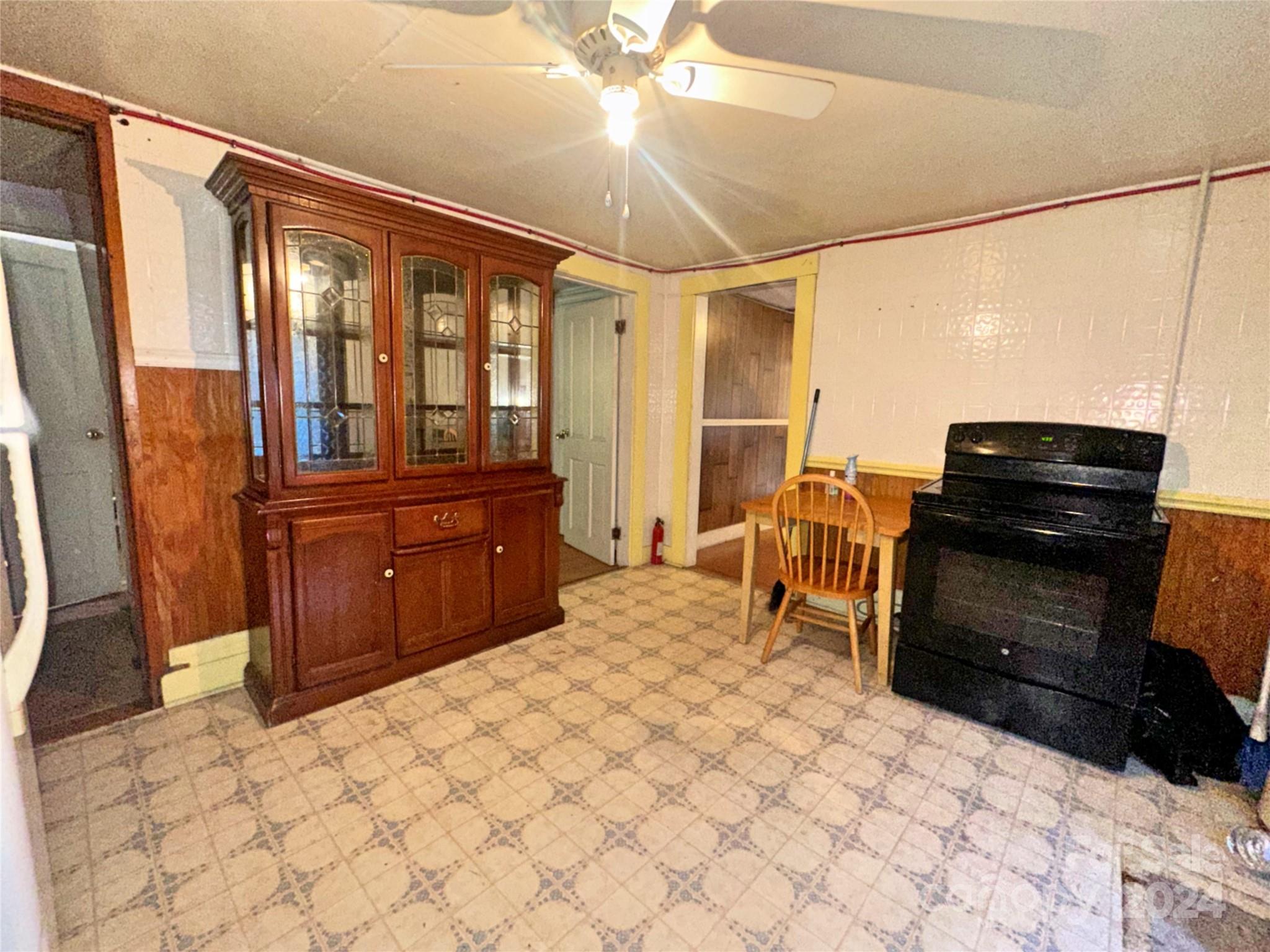 162 Raby Street Canton, NC 28716 - Photo 5 of 8 a bedroom with a bed and dresser with mirror