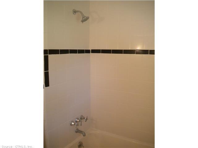 85 Green Manor Road Manchester, CT 06042 - Photo 1 of 1 a bathroom with a shower