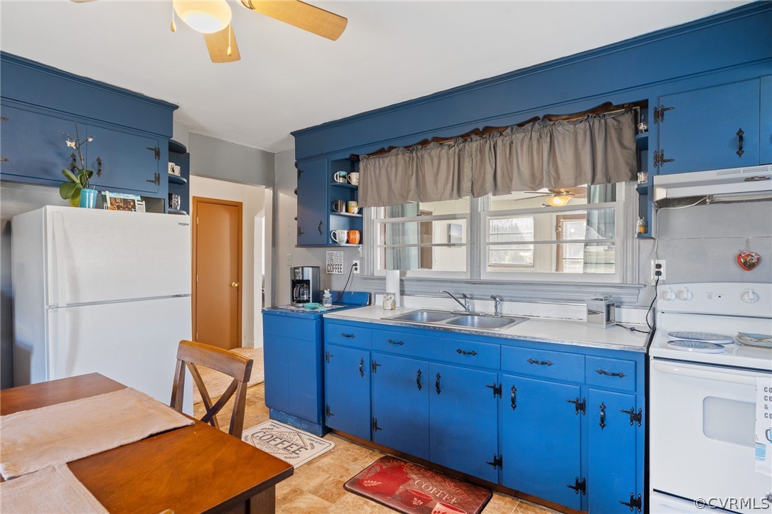 2859 East River Road Cardinal, VA 23025 - Photo 24 of 33 a kitchen with a refrigerator a sink and cabinets