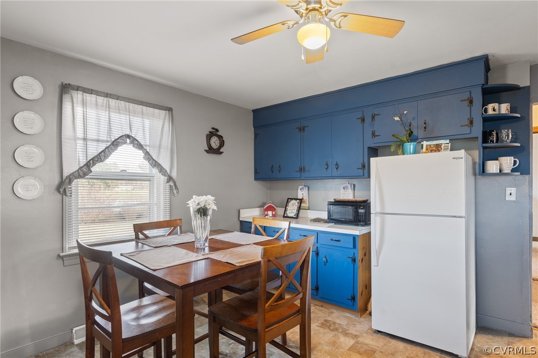2859 East River Road Cardinal, VA 23025 - Photo 25 of 33 a kitchen with a dining table and chairs