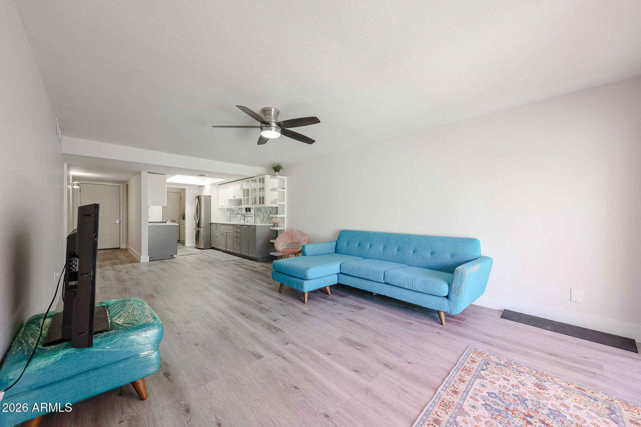 5114 East Monte Vista Road Phoenix, AZ 85008 - Photo 34 of 45 a living room with furniture and a wooden floor