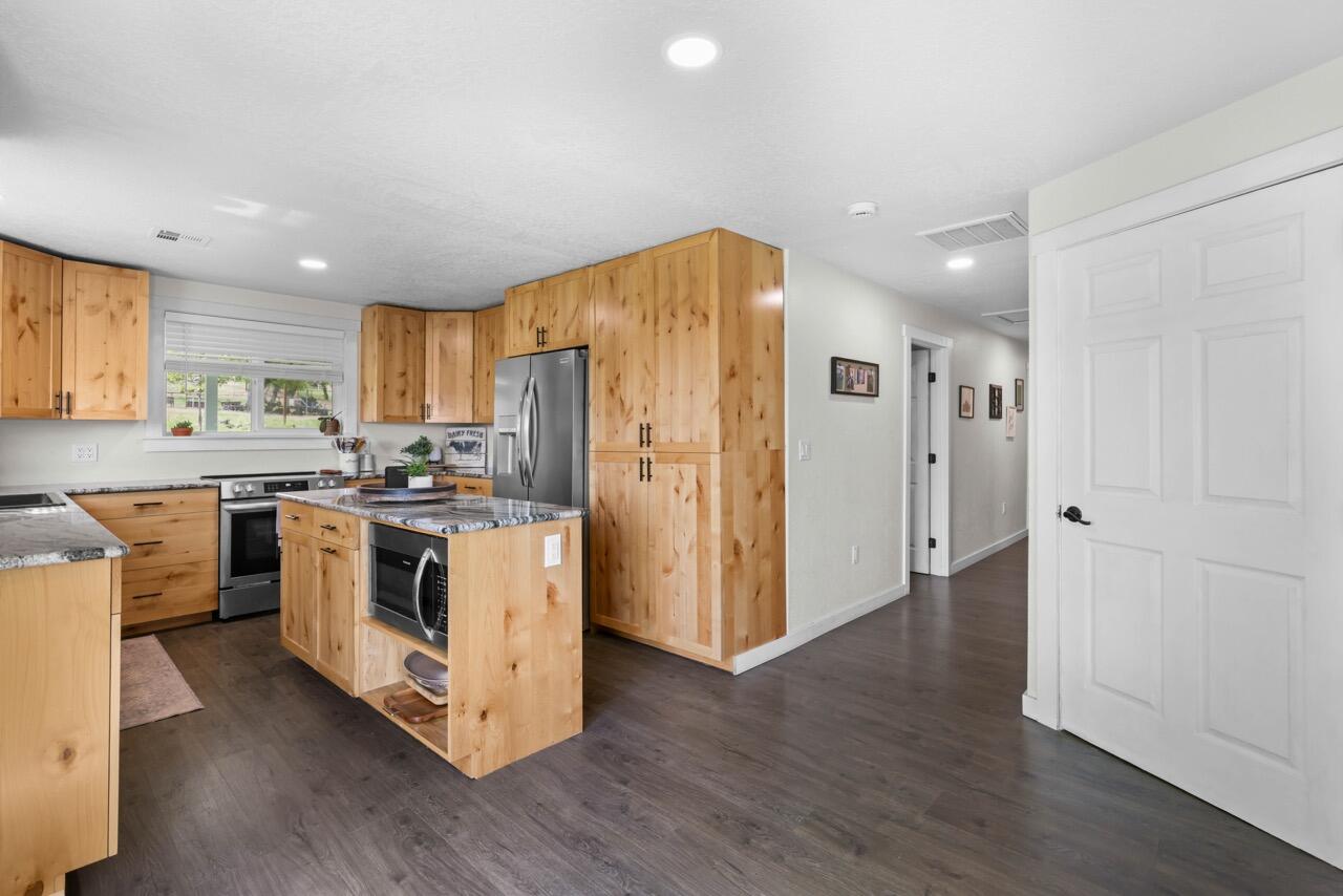 380 Greenleaf Drive Eagle Point, OR 97524 - Photo 18 of 31 a white kitchen with wooden floor