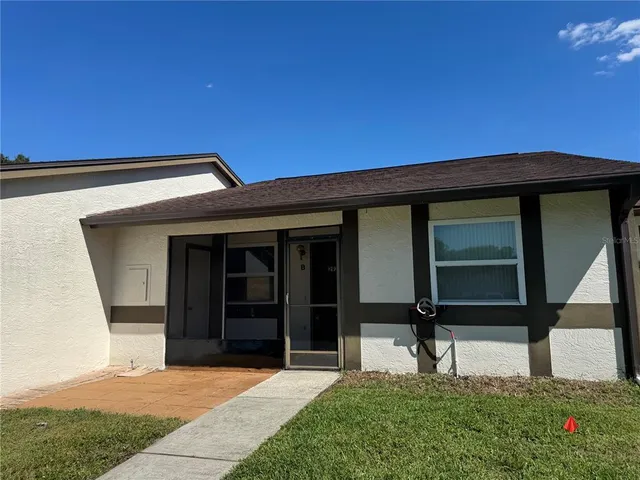 a house view with a garden space