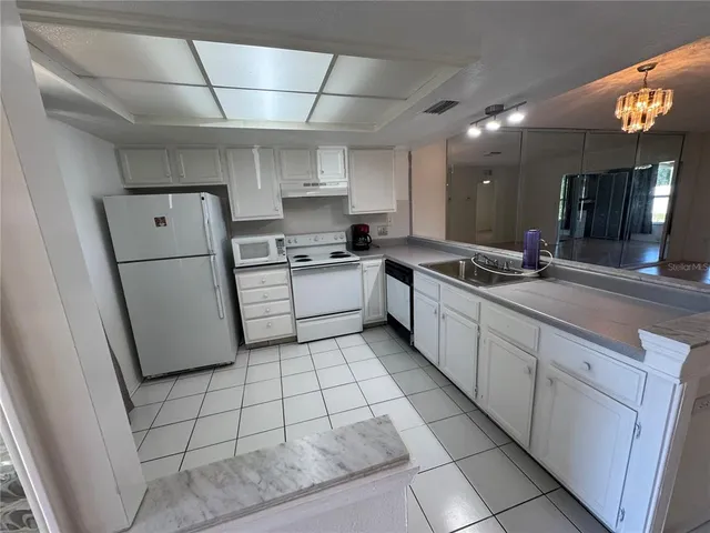 a view of storage and utility room with washer and dryer