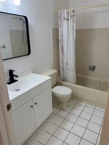 a kitchen with stainless steel appliances granite countertop a sink and a refrigerator
