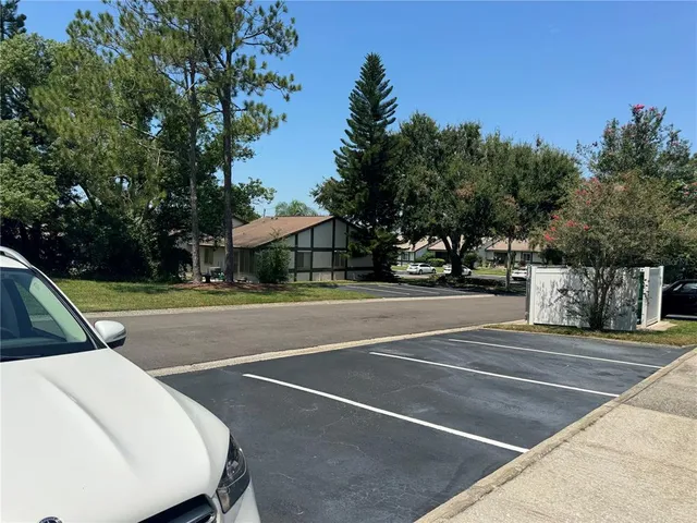 a view of sign board and garden