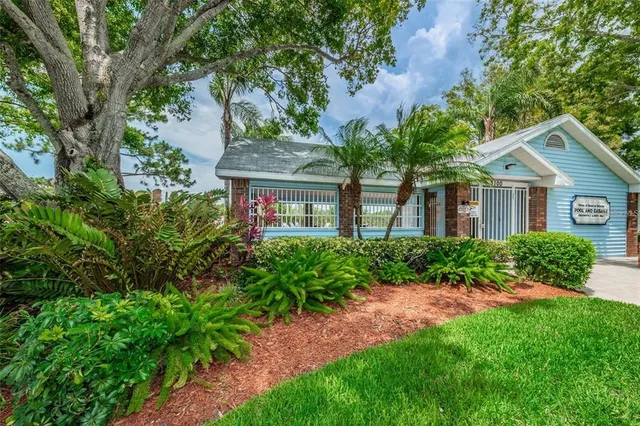 a view of a swimming pool and a yard