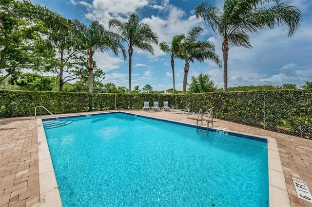 a view of swimming pool with a yard