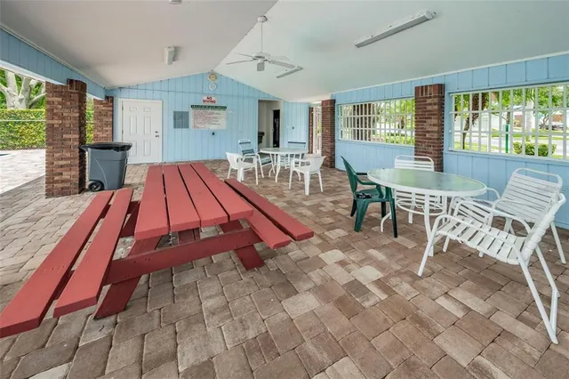 a view of a room with wooden floor and outdoor space
