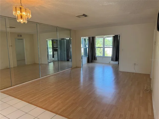 a white toilet sitting next to a shower