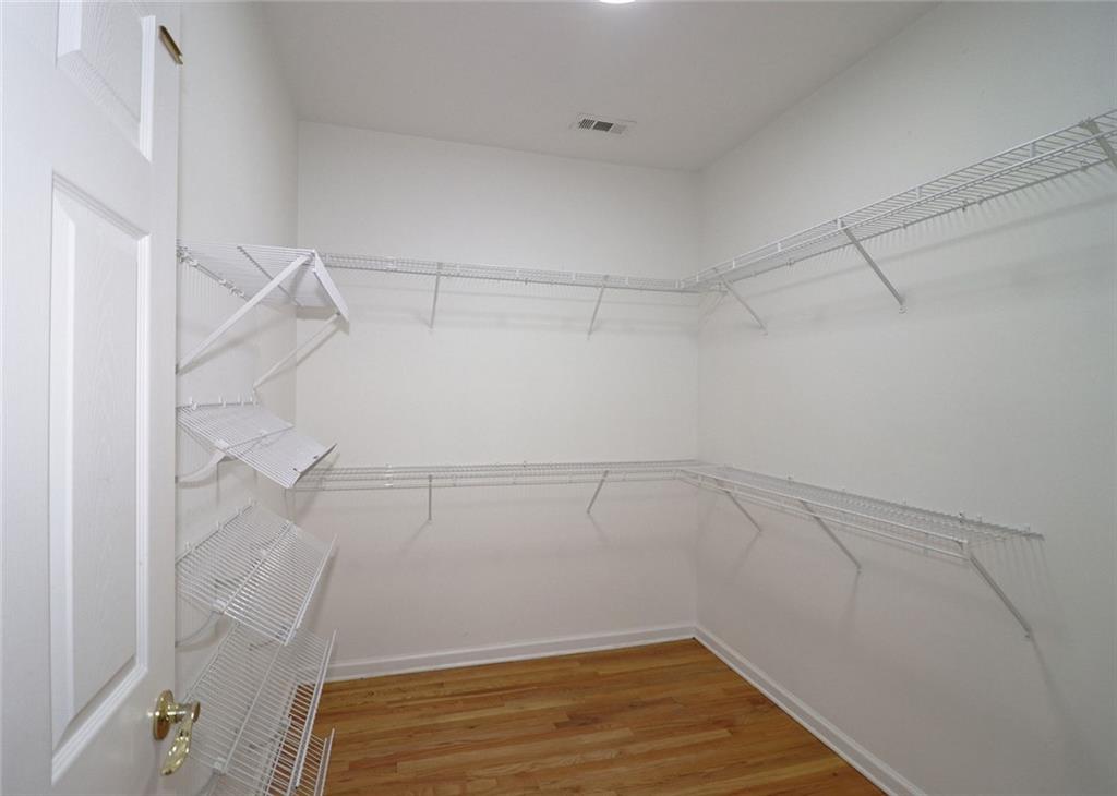 100 Wiley Hills Trail Woodstock, GA 30188 - Photo 17 of 39 a view of a room with racks on the wall