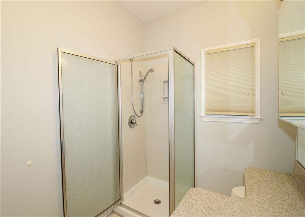 100 Wiley Hills Trail Woodstock, GA 30188 - Photo 24 of 39 a bathroom with a shower and a toilet