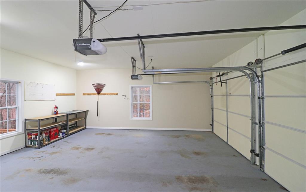 100 Wiley Hills Trail Woodstock, GA 30188 - Photo 29 of 39 a view of a garage with furniture