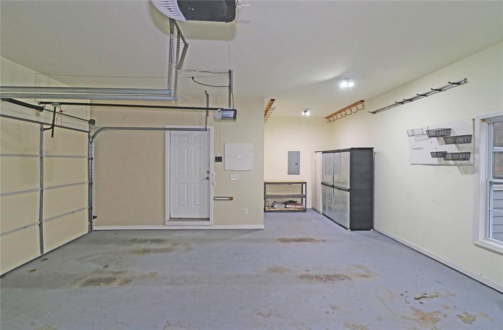 100 Wiley Hills Trail Woodstock, GA 30188 - Photo 30 of 39 a view of a refrigerator in kitchen and a white kitchen