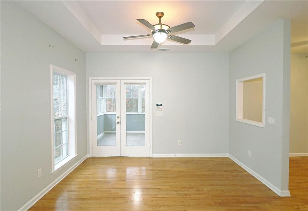 100 Wiley Hills Trail Woodstock, GA 30188 - Photo 5 of 39 a view of an empty room with window and a kitchen