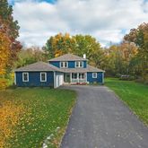 a front view of a house with yard
